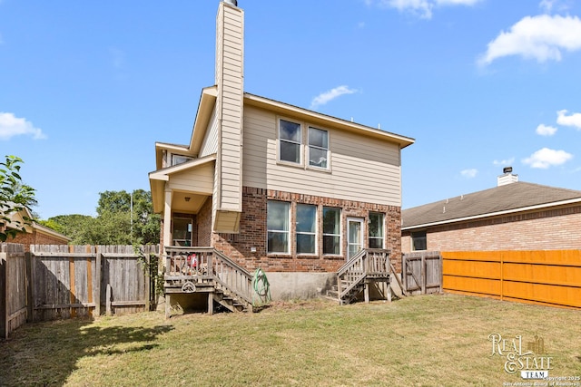 6027 Still Mdw, San Antonio, TX 78222 - rear view of property with a fenced backyard, stairway, a chimney, and brick siding