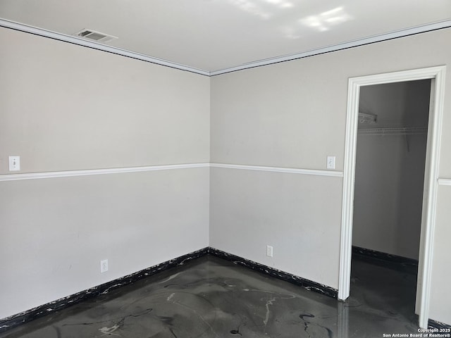 623 Coral Hbr, San Antonio, TX 78251 - unfurnished bedroom featuring a walk in closet, concrete flooring, and a closet