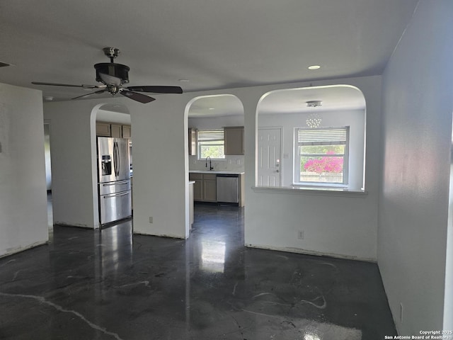623 Coral Hbr, San Antonio, TX 78251 - empty room with concrete flooring, ceiling fan, and arched walkways