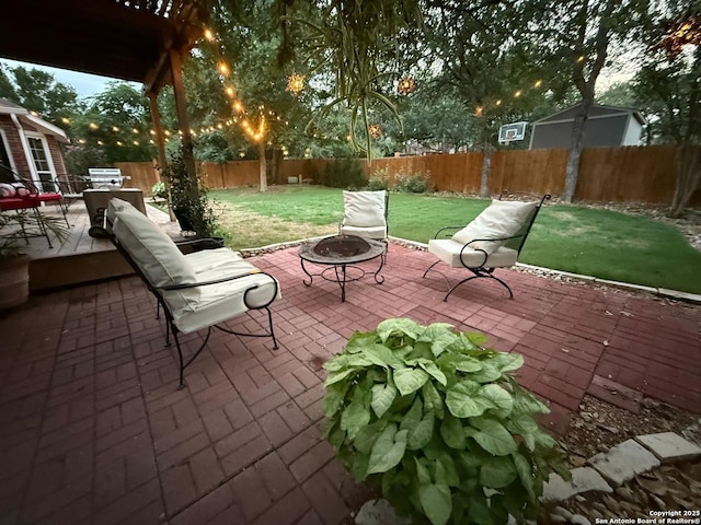 13011 Vidorra Vis, San Antonio, TX 78216 - fenced backyard with a fire pit and a patio