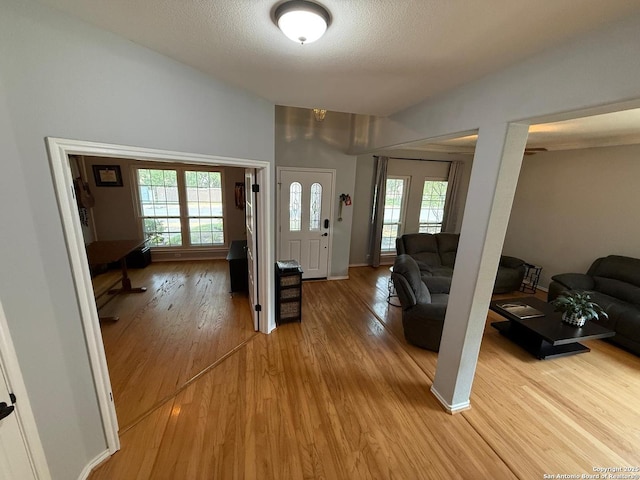 13011 Vidorra Vis, San Antonio, TX 78216 - entrance foyer with light wood-style flooring and a textured ceiling