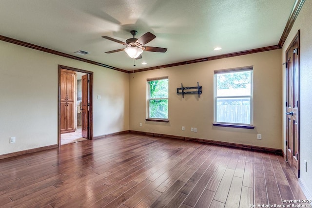 10615 Bar X Trl, San Antonio, TX 78023 - empty room with a ceiling fan, wood finished floors, and crown molding