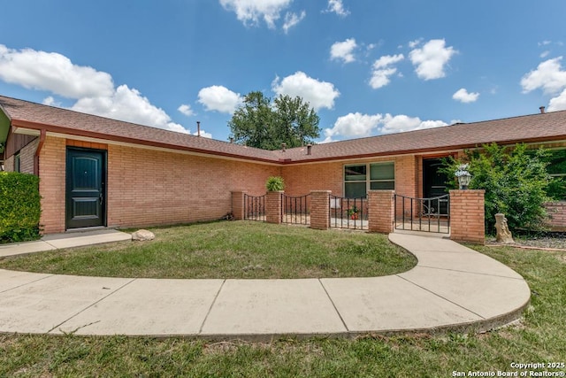 10615 Bar X Trl, San Antonio, TX 78023 - rear view of property featuring brick siding and a gate