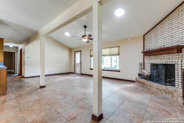 10615 Bar X Trl, San Antonio, TX 78023 - unfurnished living room featuring ceiling fan, vaulted ceiling, a fireplace, and light tile patterned flooring