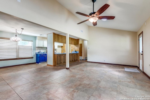 10615 Bar X Trl, San Antonio, TX 78023 - unfurnished living room featuring a ceiling fan and high vaulted ceiling