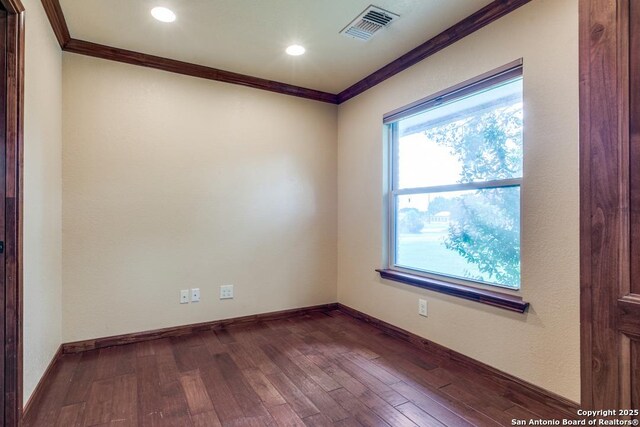 10615 Bar X Trl, San Antonio, TX 78023 - spare room featuring ornamental molding, dark wood-type flooring, and recessed lighting
