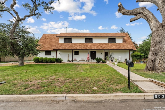 6033 Cammie, Leon Valley, TX 78238 - traditional-style house featuring a porch and a front yard