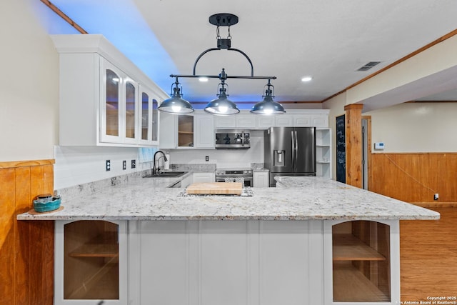 6033 Cammie, Leon Valley, TX 78238 - kitchen featuring open shelves, stainless steel appliances, glass insert cabinets, light stone countertops, and white cabinets