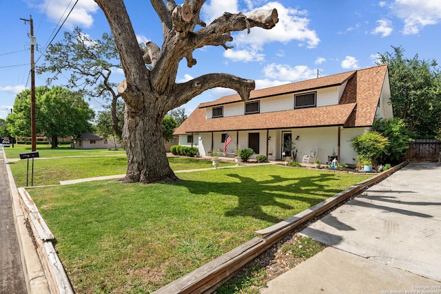 6033 Cammie, Leon Valley, TX 78238 - view of front facade with covered porch, brick siding, and roof with shingles