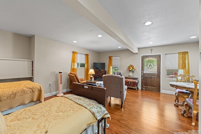 6033 Cammie, Leon Valley, TX 78238 - bedroom featuring recessed lighting, wood finished floors, and beam ceiling
