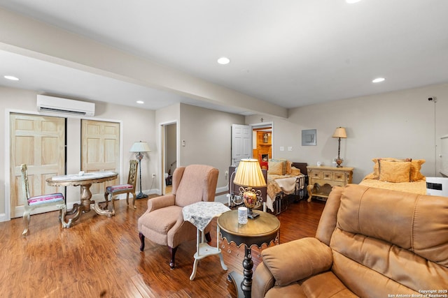 6033 Cammie, Leon Valley, TX 78238 - living area featuring a wall unit AC, wood finished floors, and recessed lighting