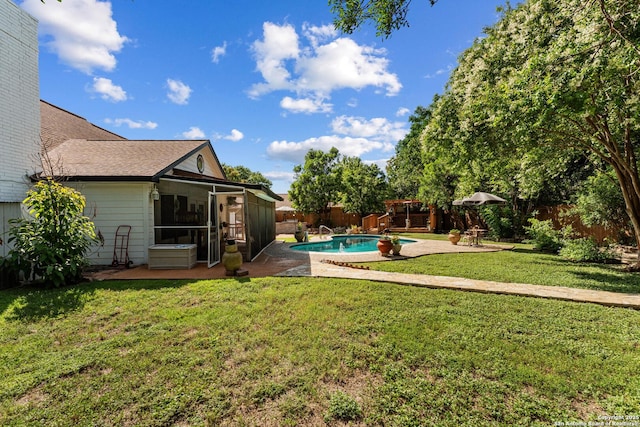 6033 Cammie, Leon Valley, TX 78238 - fenced backyard with a sunroom and a patio