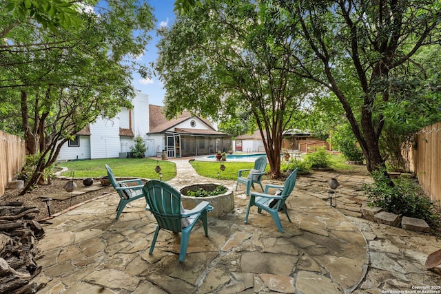 6033 Cammie, Leon Valley, TX 78238 - fenced backyard featuring a sunroom and a patio