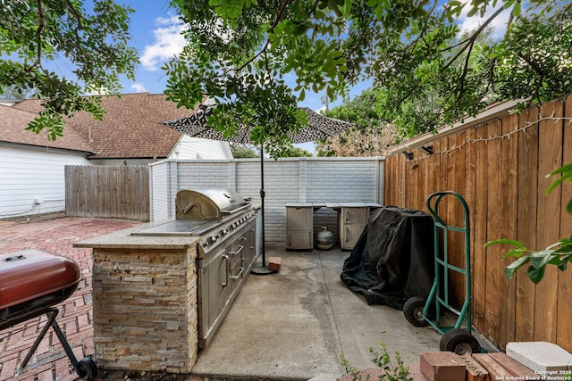 6033 Cammie, Leon Valley, TX 78238 - fenced backyard with area for grilling and a patio area