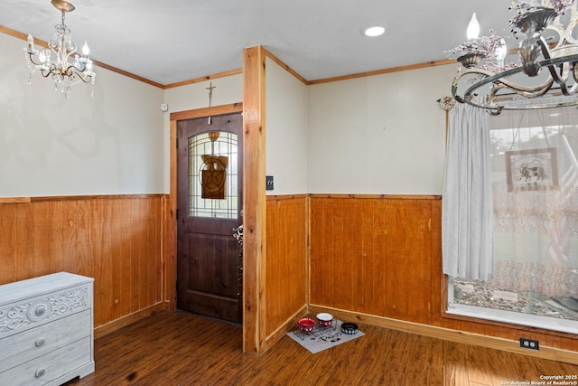 6033 Cammie, Leon Valley, TX 78238 - foyer featuring a chandelier, wainscoting, crown molding, wood finished floors, and wooden walls