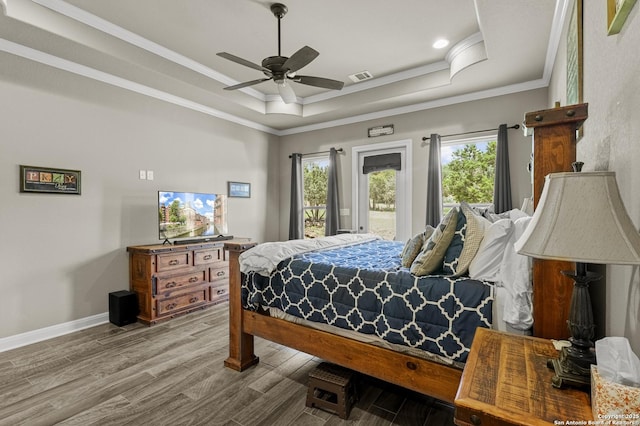 1117 Provence Pl, New Braunfels, TX 78132 - bedroom with a tray ceiling, wood finished floors, crown molding, access to exterior, and a ceiling fan