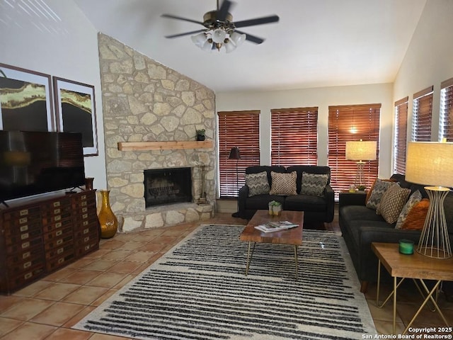 405 Short Circuit Unit 1, Horseshoe Bay, TX 78657 - living room with vaulted ceiling, ceiling fan, tile patterned flooring, and a stone fireplace