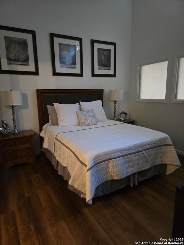 405 Short Circuit Unit 1, Horseshoe Bay, TX 78657 - bedroom featuring dark wood-style floors and baseboards