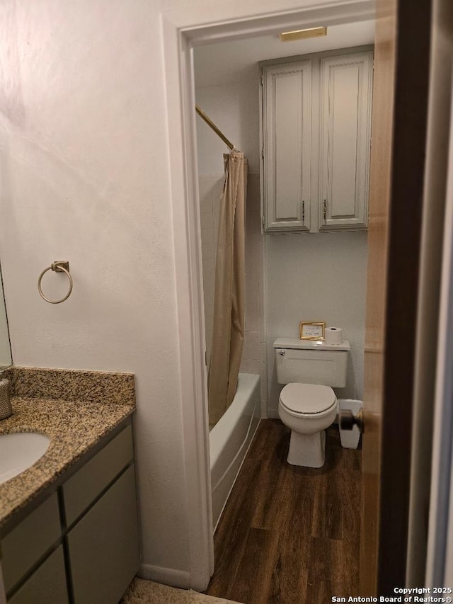 405 Short Circuit Unit 1, Horseshoe Bay, TX 78657 - full bathroom featuring vanity, wood finished floors, and shower / bathtub combination with curtain
