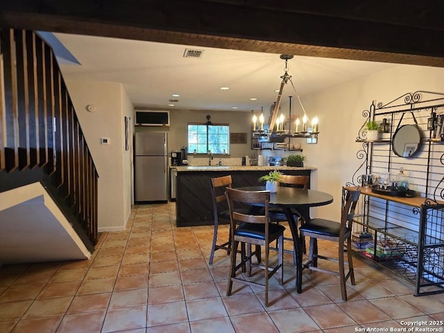 405 Short Circuit Unit 1, Horseshoe Bay, TX 78657 - dining area featuring a chandelier, light tile patterned floors, and recessed lighting