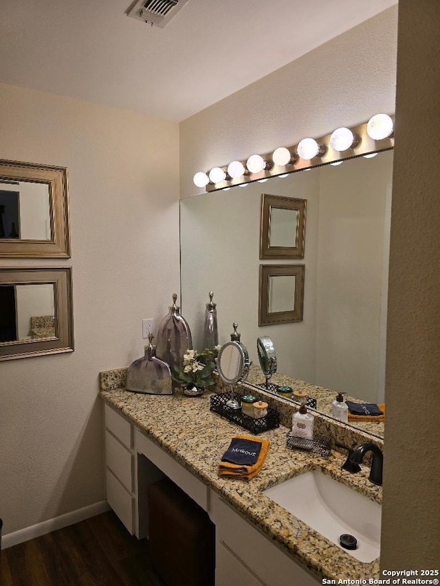 405 Short Circuit Unit 1, Horseshoe Bay, TX 78657 - bathroom with wood finished floors and vanity
