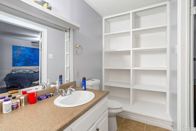 3702 Pipers Fld, San Antonio, TX 78251 - bathroom with vanity, tile patterned floors, and a textured ceiling
