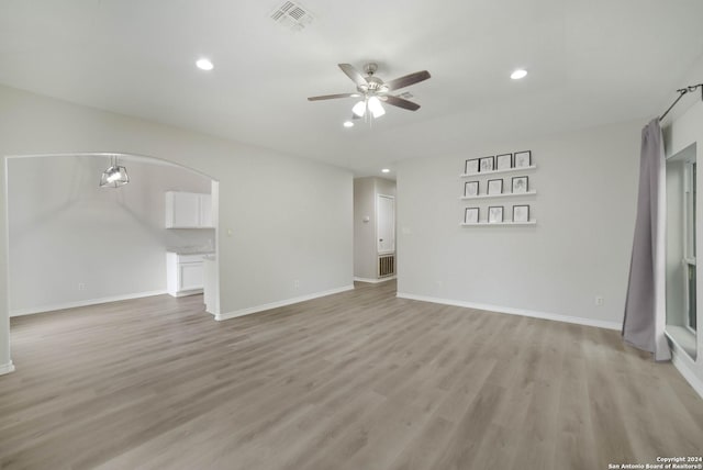 422 Regal View Dr, San Antonio, TX 78220 - unfurnished living room featuring a ceiling fan, light wood finished floors, and recessed lighting