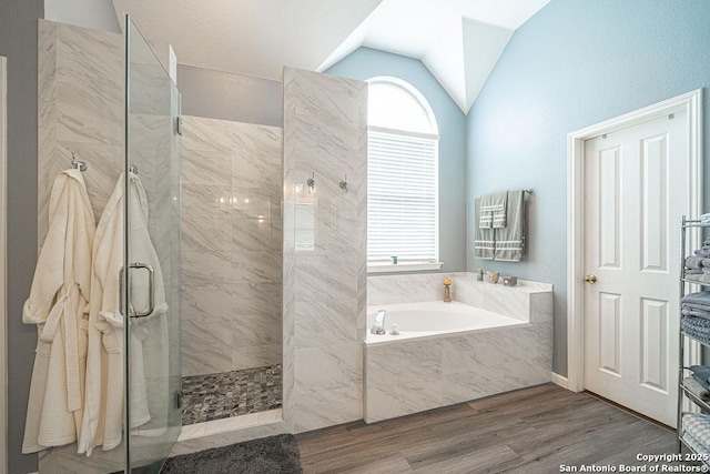 26304 Tiffnilee, San Antonio, TX 78255 - bathroom featuring a garden tub, lofted ceiling, plenty of natural light, a marble finish shower, and wood finished floors