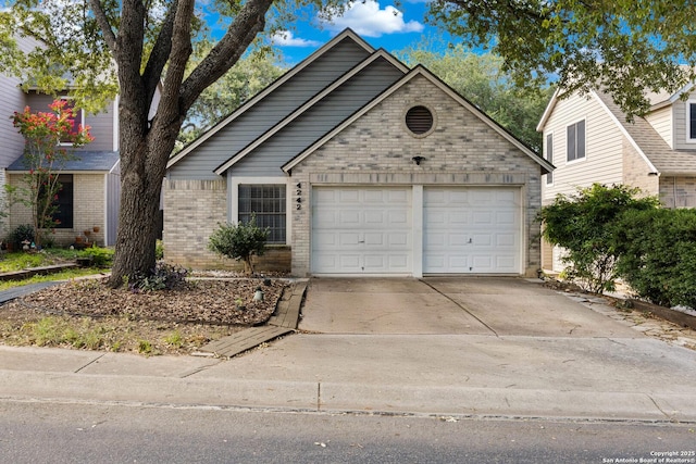 4242 Shady Tree Ln, San Antonio, TX 78247 - view of front of property with brick siding, a garage, and concrete driveway