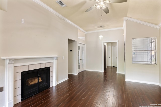 4242 Shady Tree Ln, San Antonio, TX 78247 - unfurnished living room featuring ceiling fan, a fireplace, dark wood-style flooring, crown molding, and vaulted ceiling