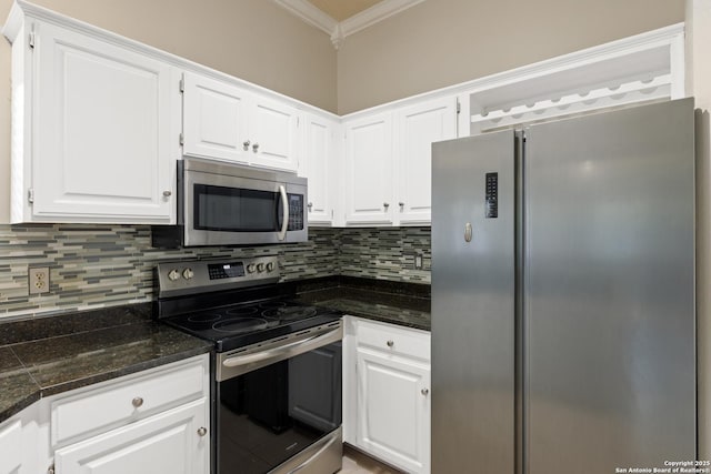4242 Shady Tree Ln, San Antonio, TX 78247 - kitchen featuring stainless steel appliances, crown molding, dark countertops, white cabinets, and tasteful backsplash
