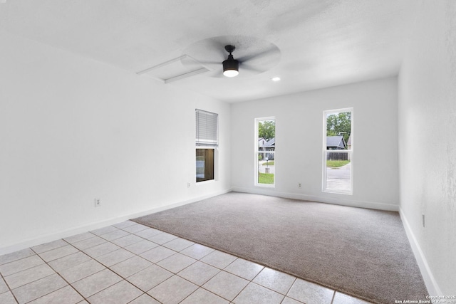 5530 Rangeland, San Antonio, TX 78247 - empty room featuring light colored carpet, light tile patterned floors, and a ceiling fan