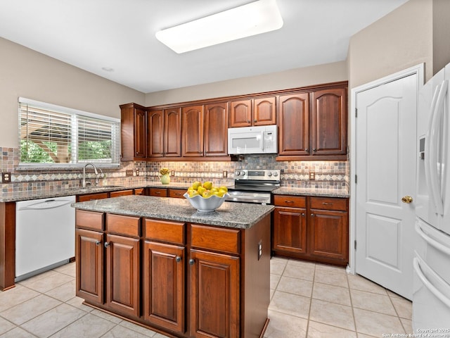 5 Greta Dr, San Antonio, TX 78248 - kitchen with white appliances, decorative backsplash, a kitchen island, and light tile patterned floors