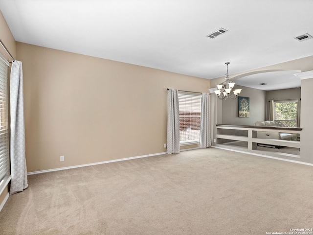 5 Greta Dr, San Antonio, TX 78248 - unfurnished living room featuring a chandelier, carpet floors, and arched walkways