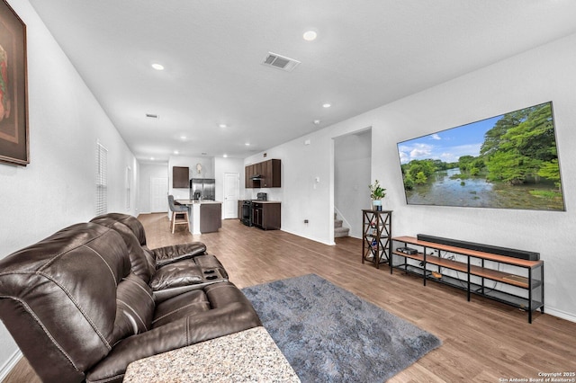 14016 Breccia Loop, San Antonio, TX 78253 - living area featuring wood finished floors, stairs, and recessed lighting