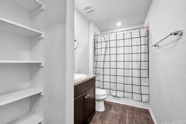 14016 Breccia Loop, San Antonio, TX 78253 - bathroom featuring wood finished floors, vanity, a textured wall, and shower / bathtub combination with curtain
