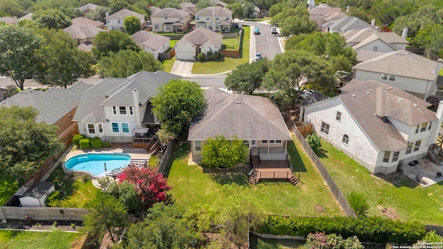 665 La Bahia Loop, New Braunfels, TX 78132 - aerial perspective of suburban area featuring a pool area