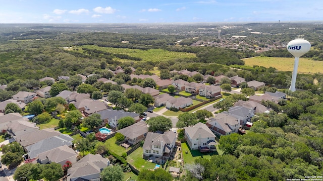 665 La Bahia Loop, New Braunfels, TX 78132 - aerial perspective of suburban area with a heavily wooded area