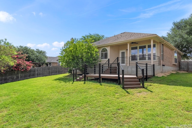 665 La Bahia Loop, New Braunfels, TX 78132 - rear view of property featuring a fenced backyard, a ceiling fan, and a deck