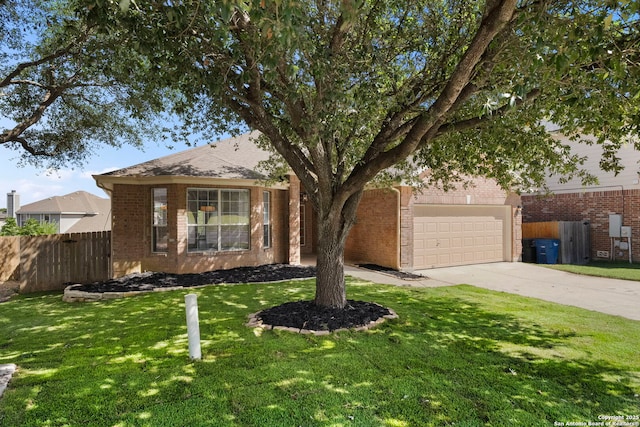 665 La Bahia Loop, New Braunfels, TX 78132 - view of front of home featuring driveway, brick siding, and an attached garage