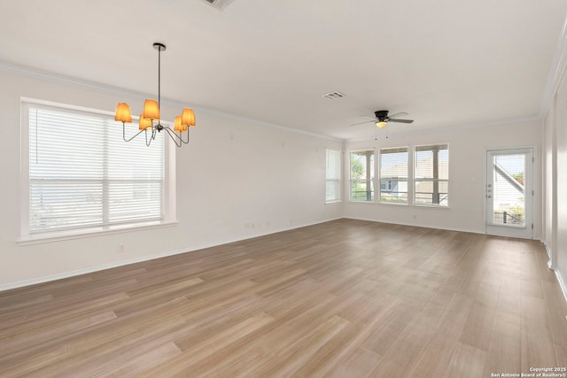 665 La Bahia Loop, New Braunfels, TX 78132 - unfurnished room with a chandelier, healthy amount of natural light, crown molding, a ceiling fan, and light wood-style flooring