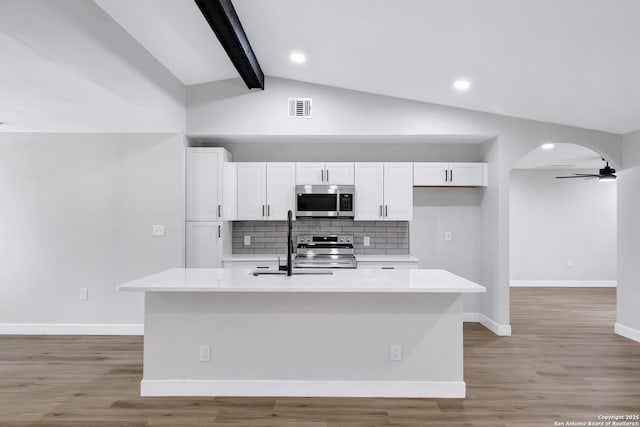 5807 Sun Rdg, San Antonio, TX 78247 - kitchen featuring stainless steel appliances, white cabinets, tasteful backsplash, light countertops, and recessed lighting