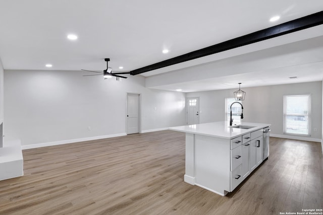 5807 Sun Rdg, San Antonio, TX 78247 - kitchen featuring open floor plan, stainless steel dishwasher, light countertops, light wood-style flooring, and recessed lighting