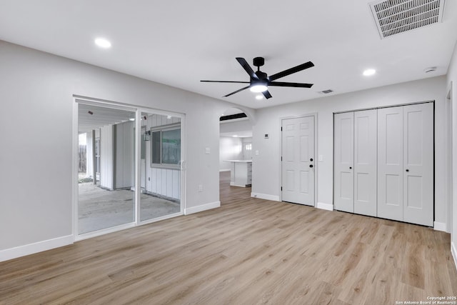5807 Sun Rdg, San Antonio, TX 78247 - unfurnished bedroom featuring light wood finished floors, arched walkways, recessed lighting, and a ceiling fan