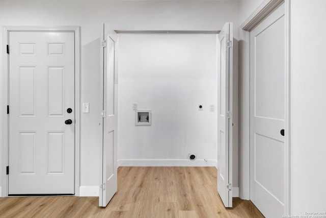 5807 Sun Rdg, San Antonio, TX 78247 - laundry area with electric dryer hookup, light wood-style floors, and washer hookup