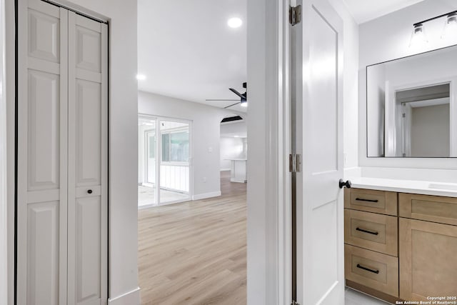 5807 Sun Rdg, San Antonio, TX 78247 - bathroom featuring ceiling fan, a closet, vanity, wood finished floors, and recessed lighting