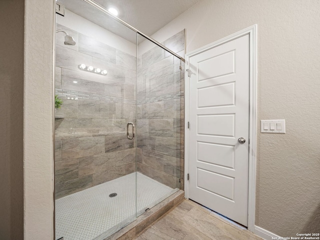 754 Farmers Dell, New Braunfels, TX 78130 - bathroom featuring a stall shower and a textured wall