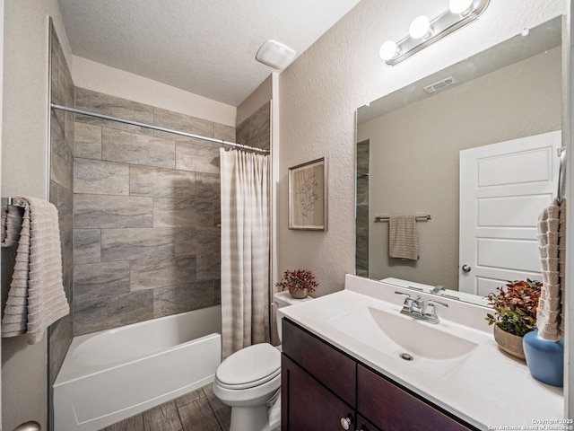 754 Farmers Dell, New Braunfels, TX 78130 - bathroom with vanity, wood finished floors, shower / tub combo with curtain, a textured ceiling, and a textured wall