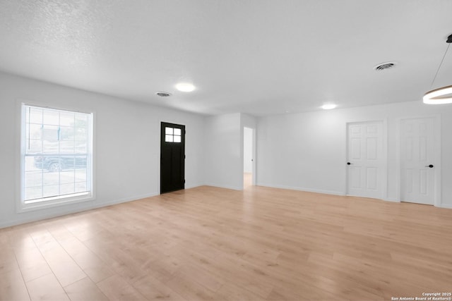 192 Meadow, New Braunfels, TX 78130 - unfurnished living room with light wood-style flooring