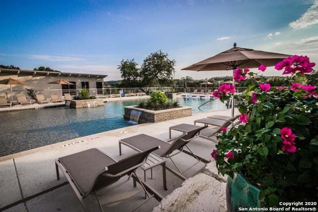 view of pool featuring a patio